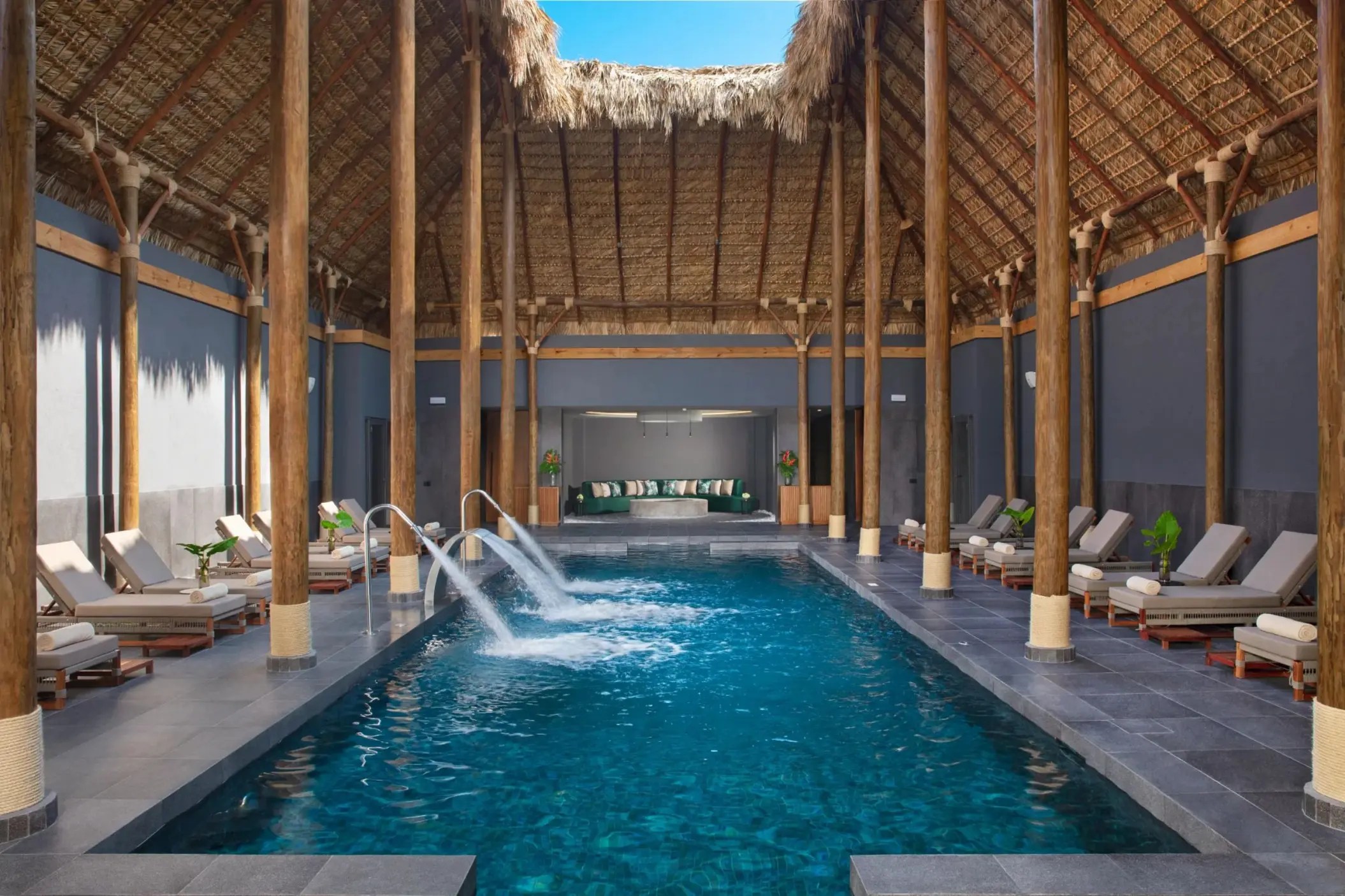 Hydrotherapy spa pool with water jets under a thatched roof at Dreams Flora, Punta Cana