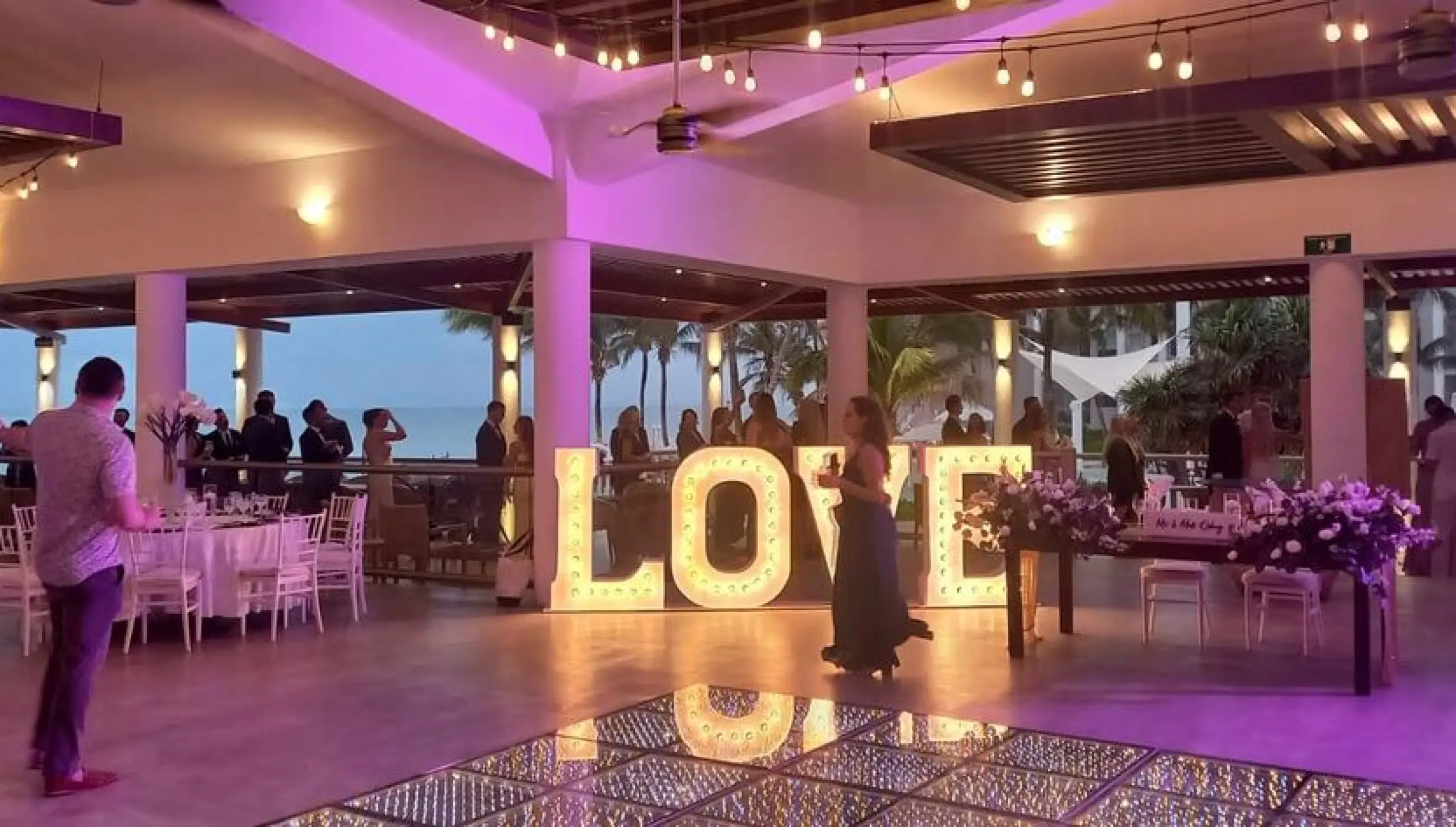 Castaways restaurant wedding reception with light-up LOVE sign at Dreams Jade, Riviera Maya