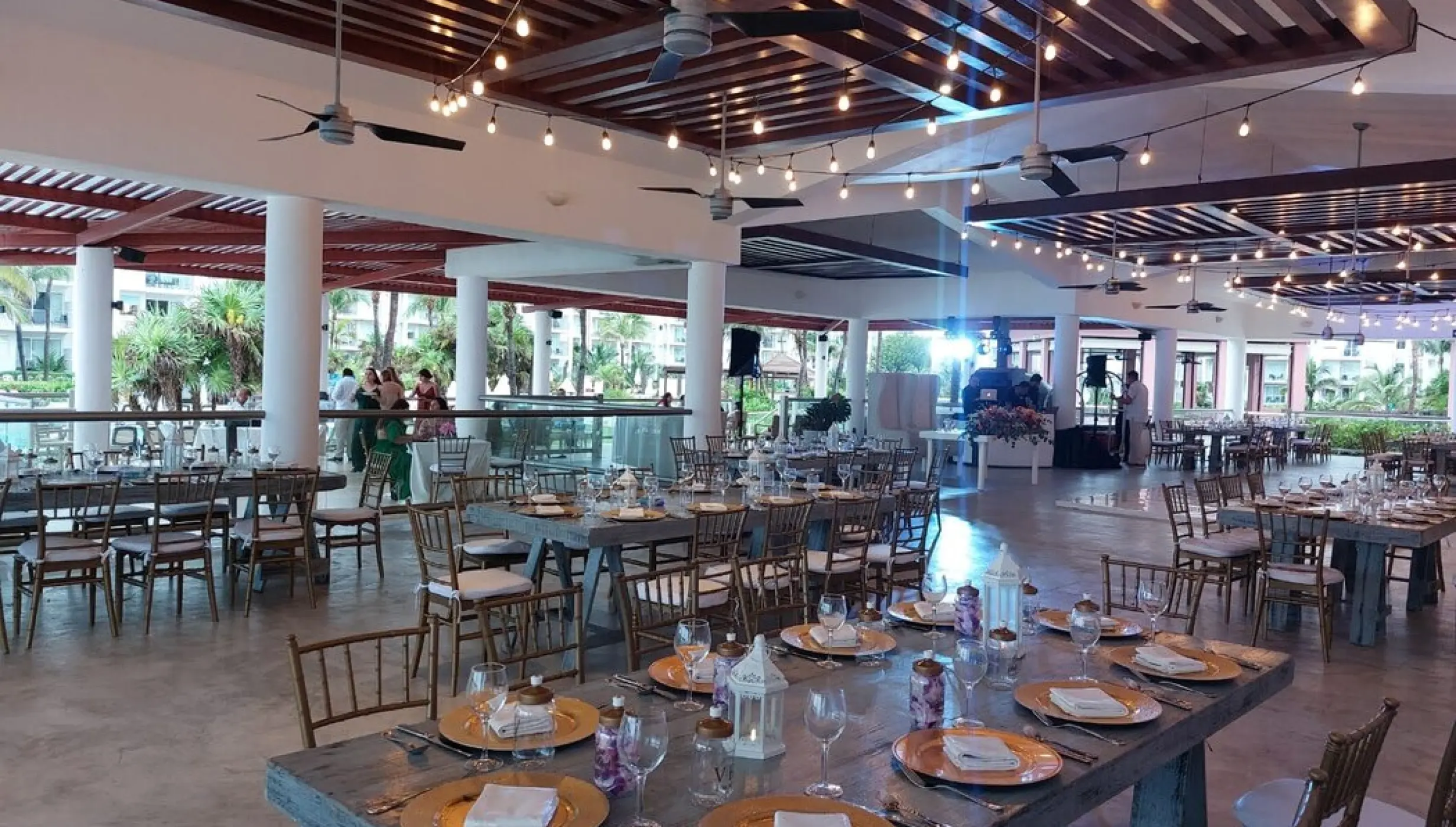 Castaways restaurant wedding reception with string lights at Dreams Jade, Riviera Maya