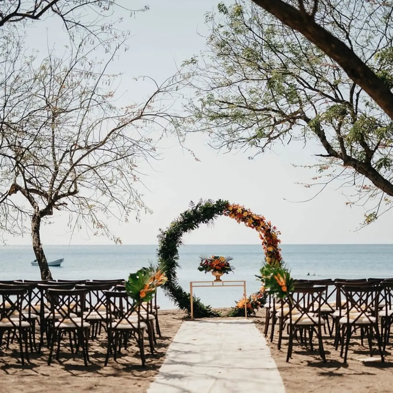 Circular floral arch for a beach ceremony at Dreams Las Mareas, Costa Rica