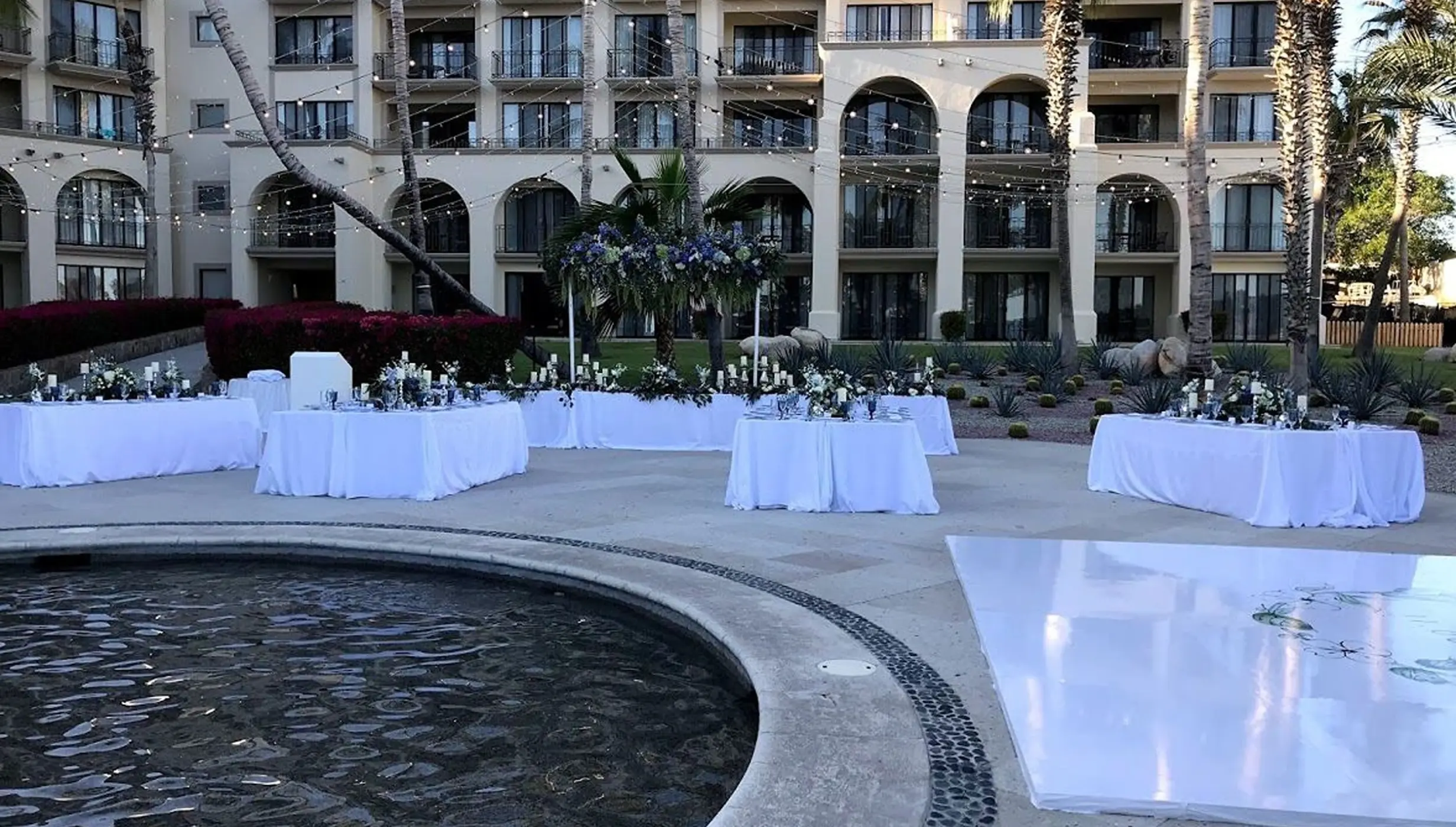 Oceana Terrace wedding reception setup with fountain and dance floor at Dreams Los Cabos, Cabo San Lucas
