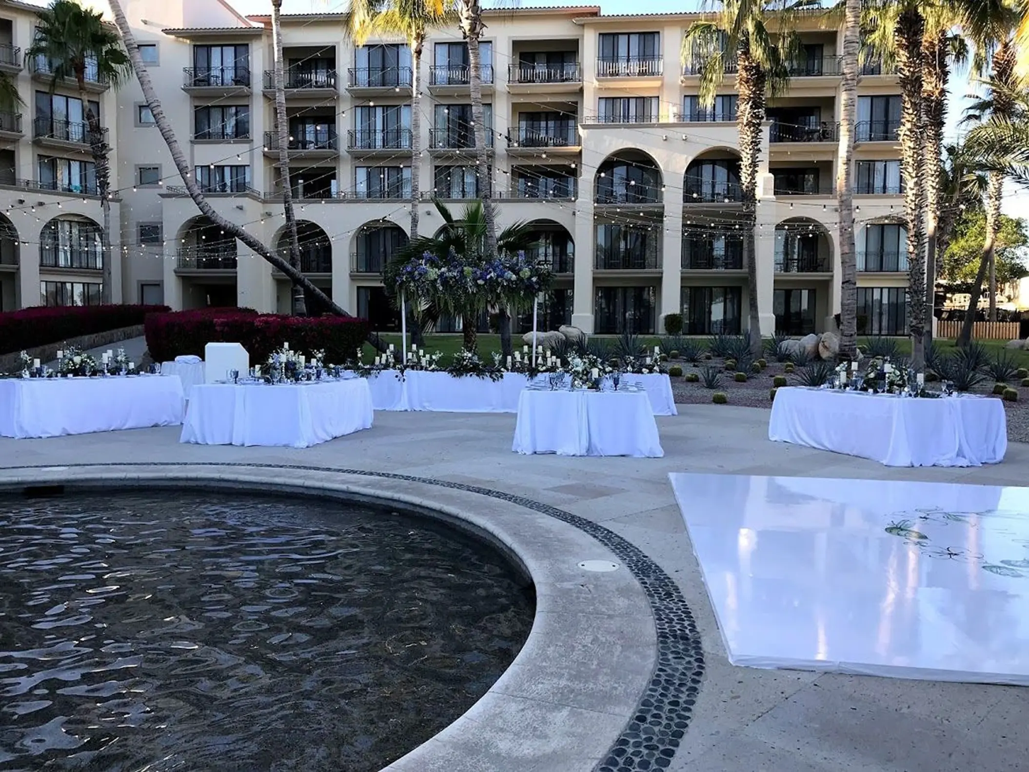 Oceana Terrace wedding reception setup with fountain and dance floor at Dreams Los Cabos, Cabo San Lucas