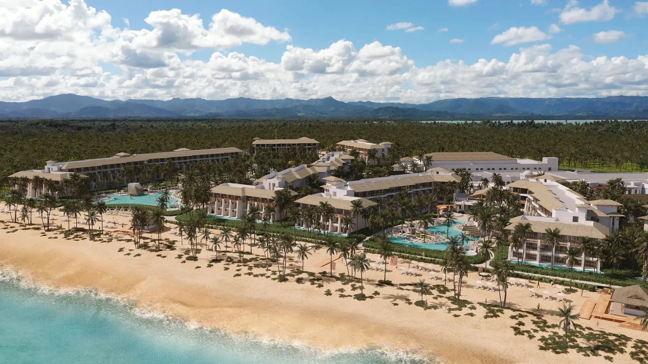 Aerial view of Dreams Playa Esmeralda buildings and pools along the sandy beach, Miches