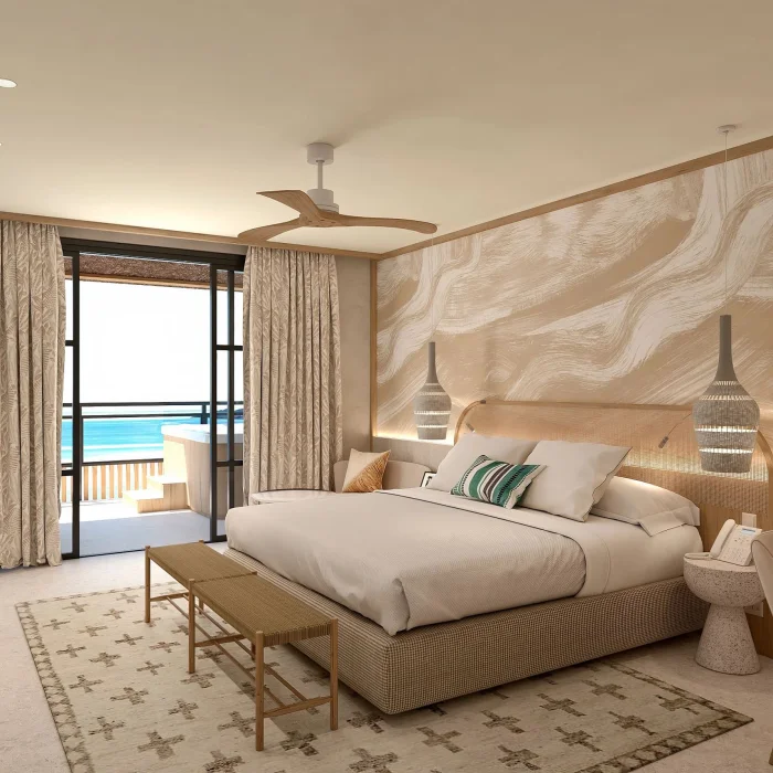 A presidential suite bedroom with a large bed, modern furnishings, and a walk-out balcony with a hot tub.
