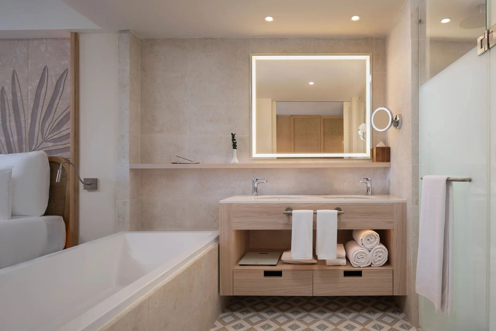 Modern suite bathroom with double vanity and soaking tub at Dreams Playa Esmeralda, Miches