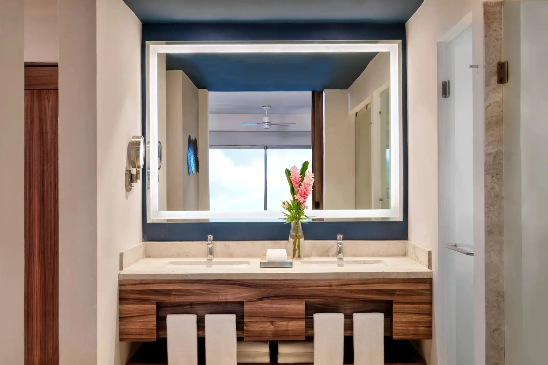 Modern double bathroom vanity with illuminated mirror at Dreams Puerto Morelos, Riviera Maya
