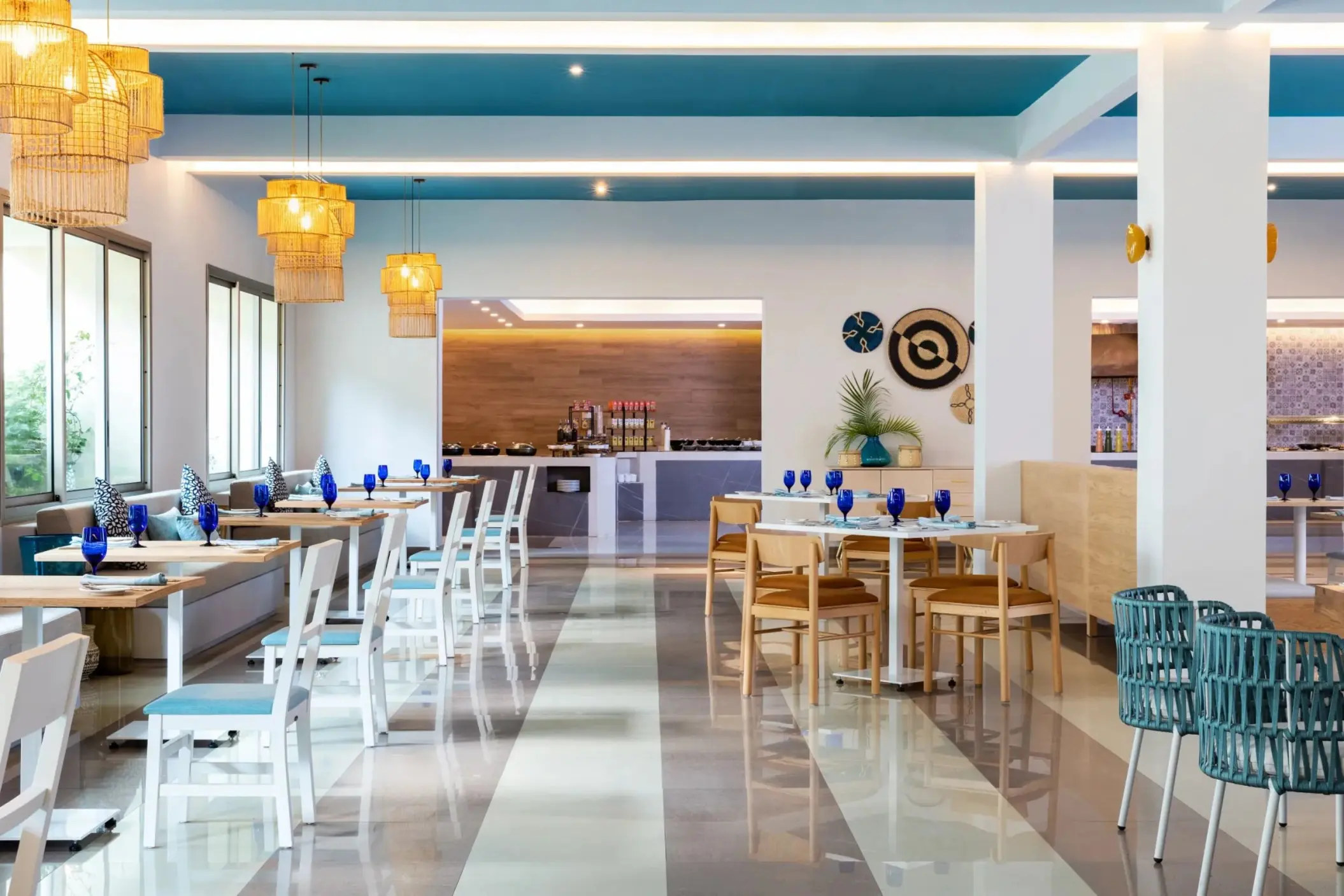 Buffet restaurant with blue and white seating at Dreams Puerto Morelos, Riviera Maya