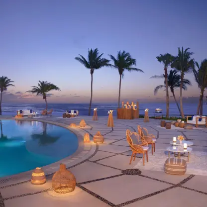 Cocktail reception setup on the pool deck at Dreams Puerto Morelos, Riviera Maya