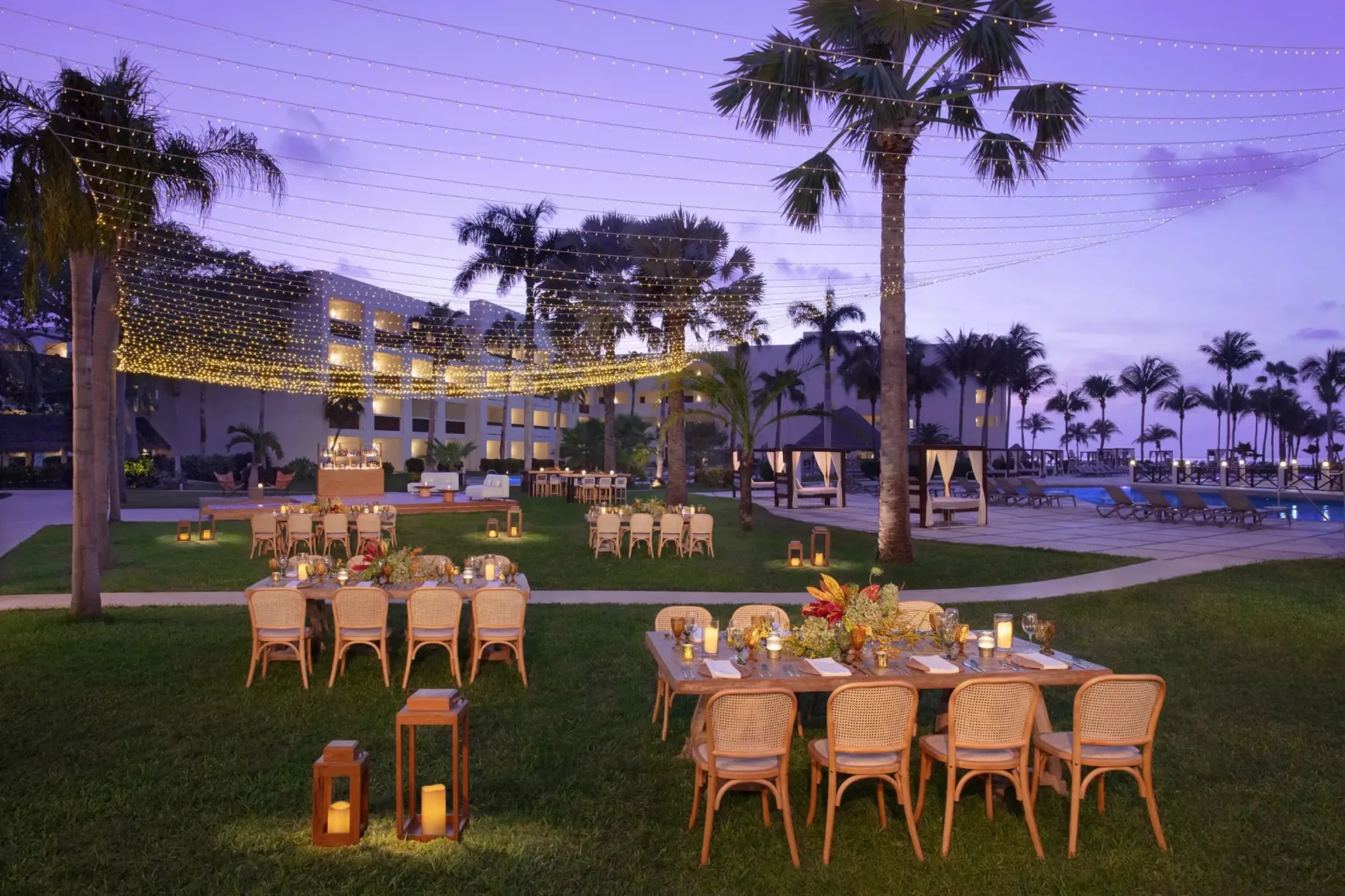 Guava Garden wedding reception with string lights at Dreams Puerto Morelos, Riviera Maya