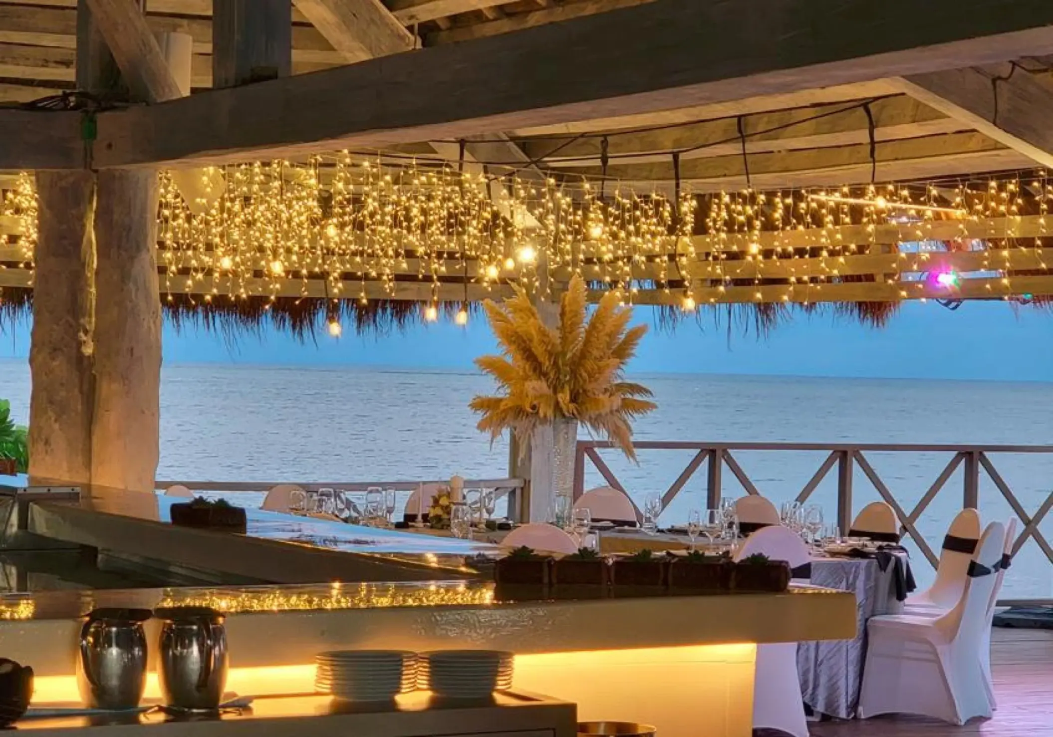 Outdoor wedding reception under fairy lights at Habaneros venue, Dreams Puerto Morelos, Riviera Maya