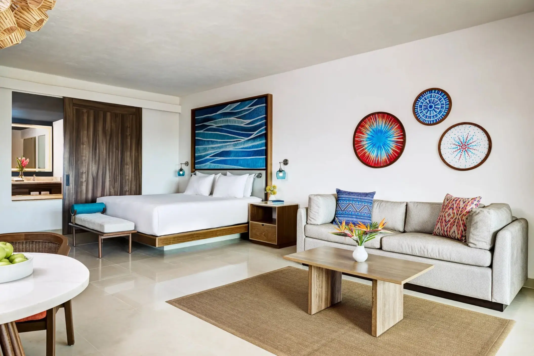 Junior king room with a sofa and living area at Dreams Puerto Morelos, Riviera Maya