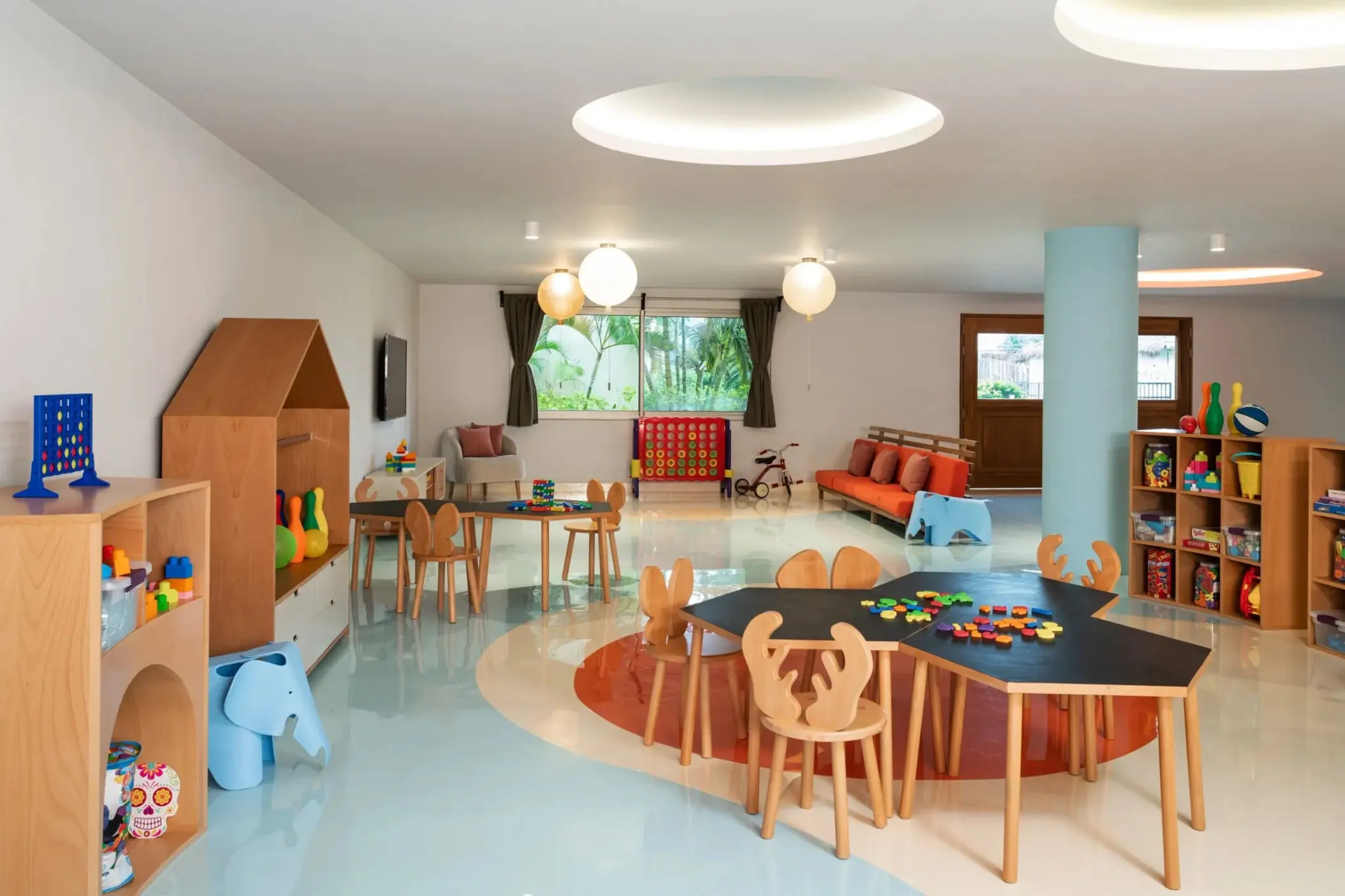 Indoor kids club with activity tables and toys at Dreams Puerto Morelos, Riviera Maya