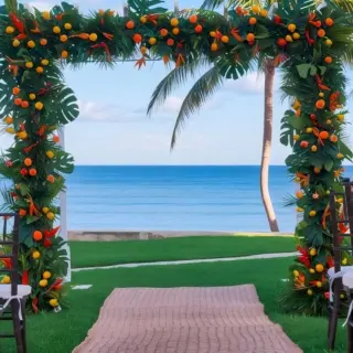 Tropical wedding ceremony arch with citrus fruit at Dreams Puerto Morelos, Riviera Maya