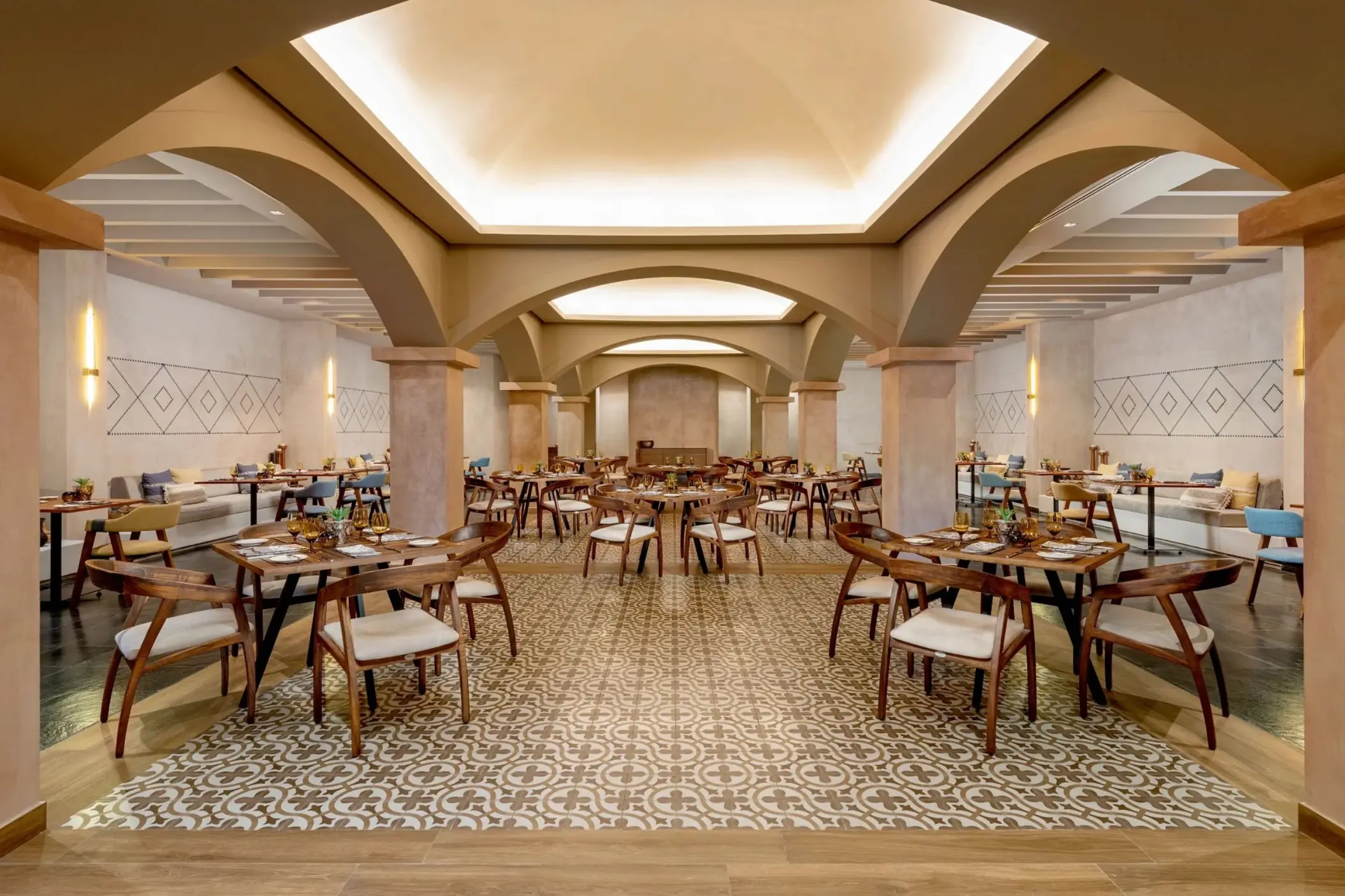 Mexican restaurant interior with arched ceilings and tiled floors at Dreams Puerto Morelos, Riviera Maya