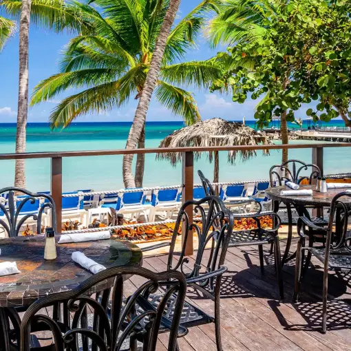 Mangoes restaurant outdoor terrace overlooking the beach at Dreams Rose Hall, Montego Bay