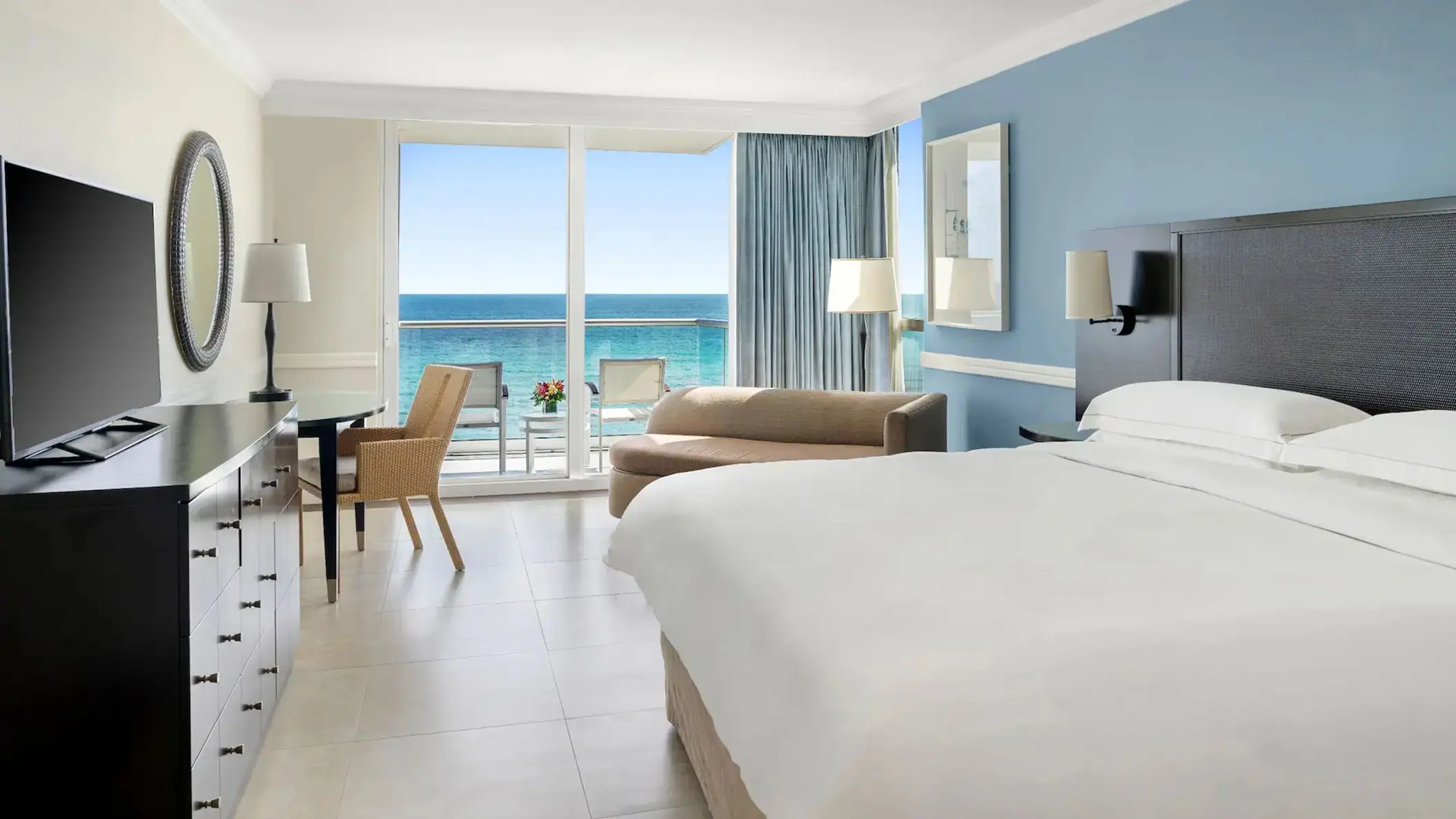 Oceanfront king suite with balcony and sea views at Dreams Rose Hall, Montego Bay