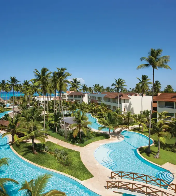 Aerial view of swimming pools and palm trees at Dreams Royal Beach, Punta Cana