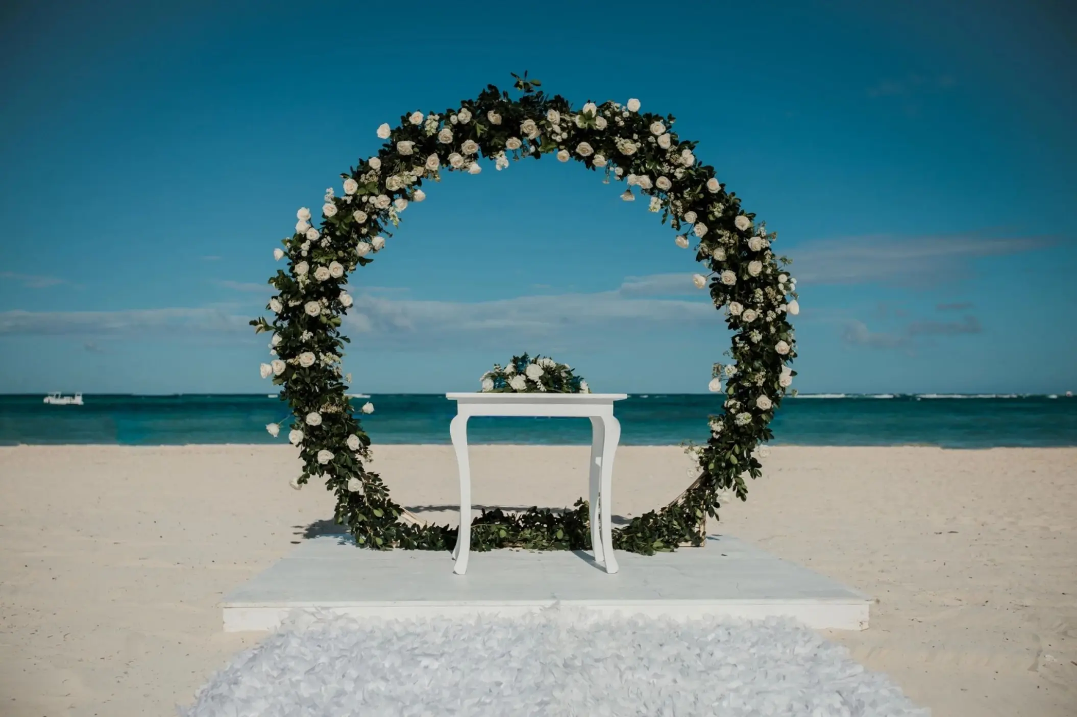 Circular floral arch for a beach ceremony at Dreams Royal Beach, Punta Cana