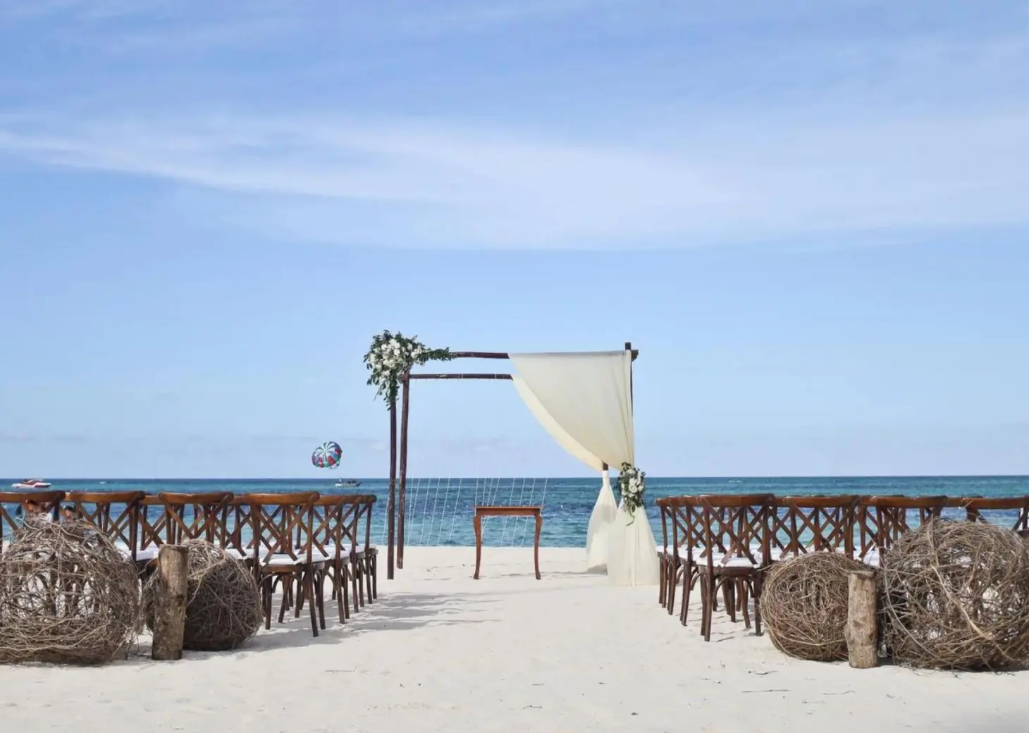 Beachfront wedding ceremony setup at Dreams Royal Beach, Punta Cana