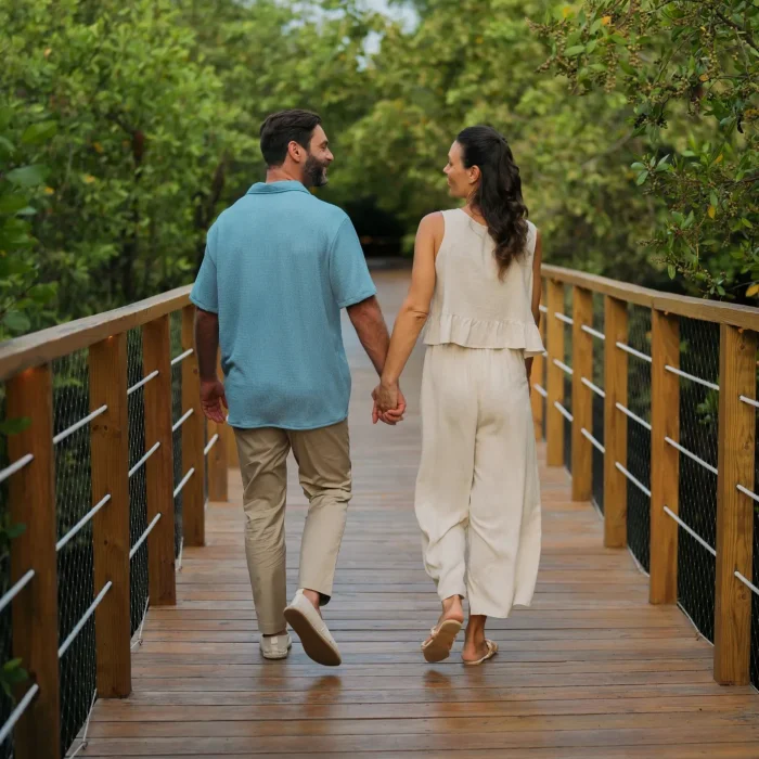 couple on the bridge over the mangroves at Dreams Royal Beach Punta Cana