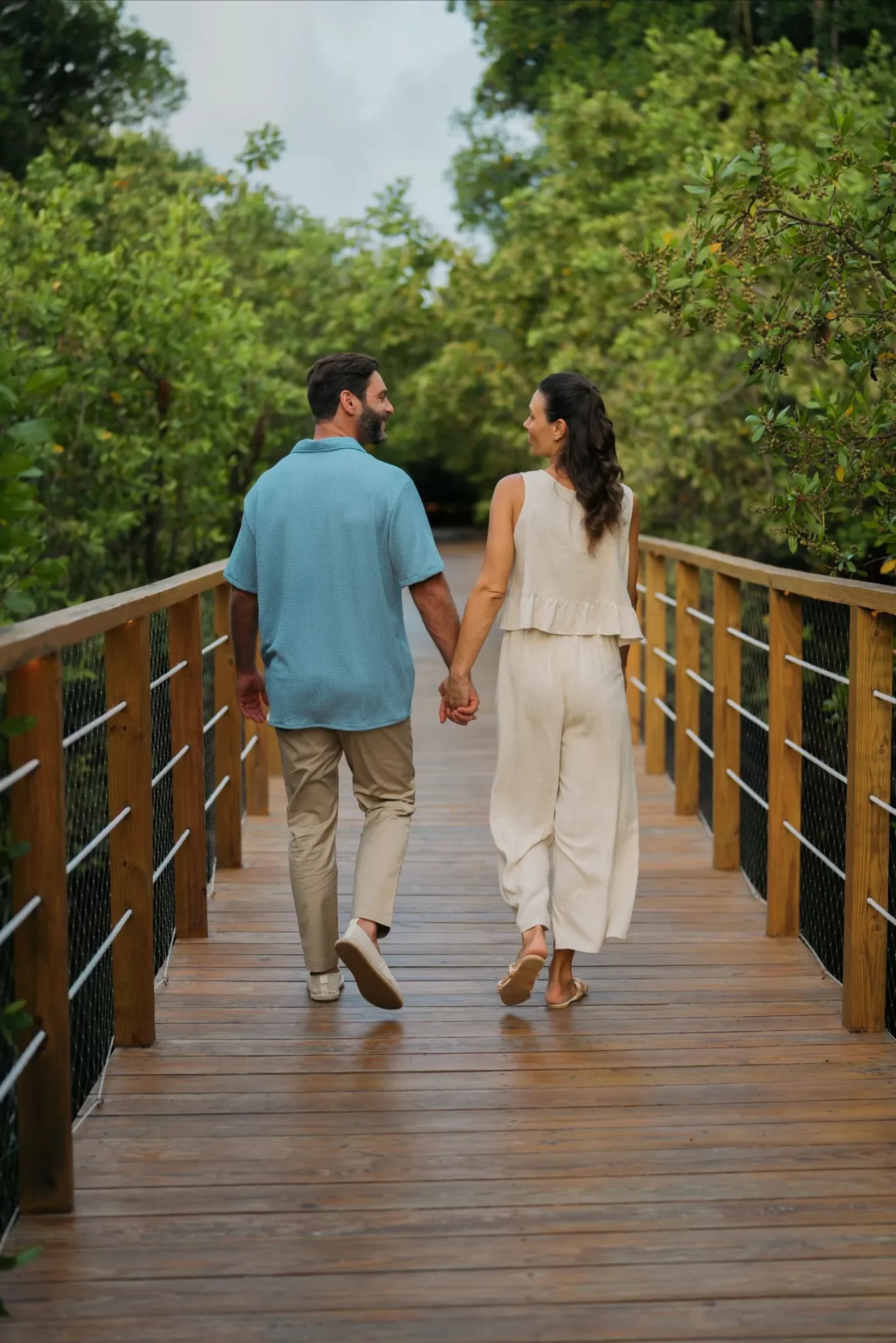 couple on the bridge over the mangroves at Dreams Royal Beach Punta Cana