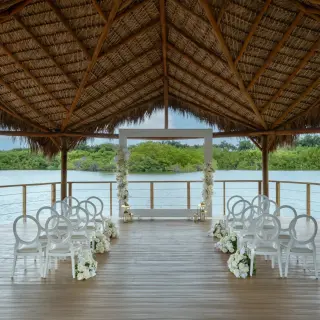 Mangrove gazebo wedding ceremony with white chairs at Dreams Royal Beach, Punta Cana
