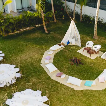 Secret Garden wedding reception with teepees and lounge cushions at Dreams Sapphire, Riviera Maya