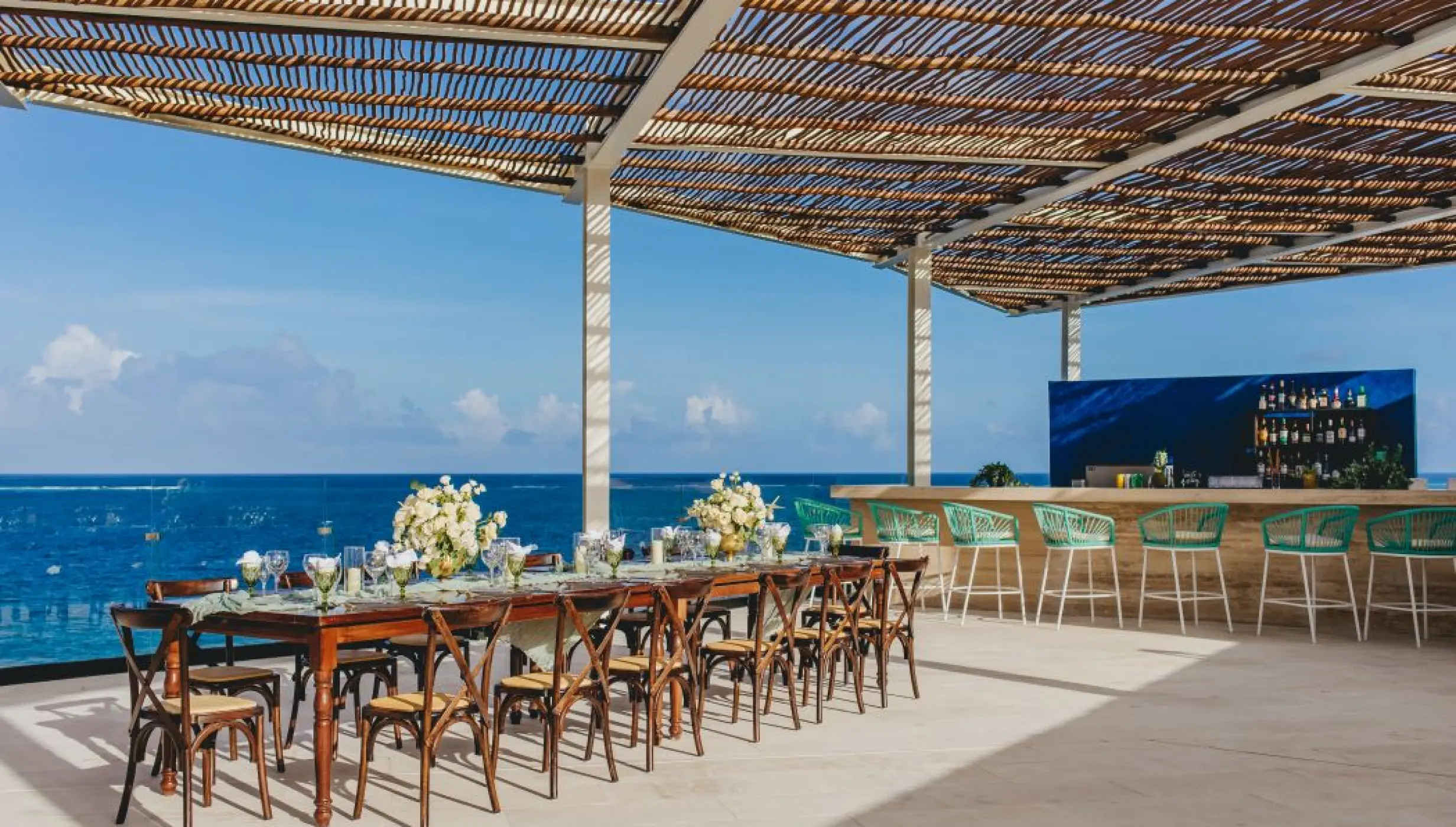 Sky rooftop wedding reception with ocean views at Dreams Sapphire, Riviera Maya