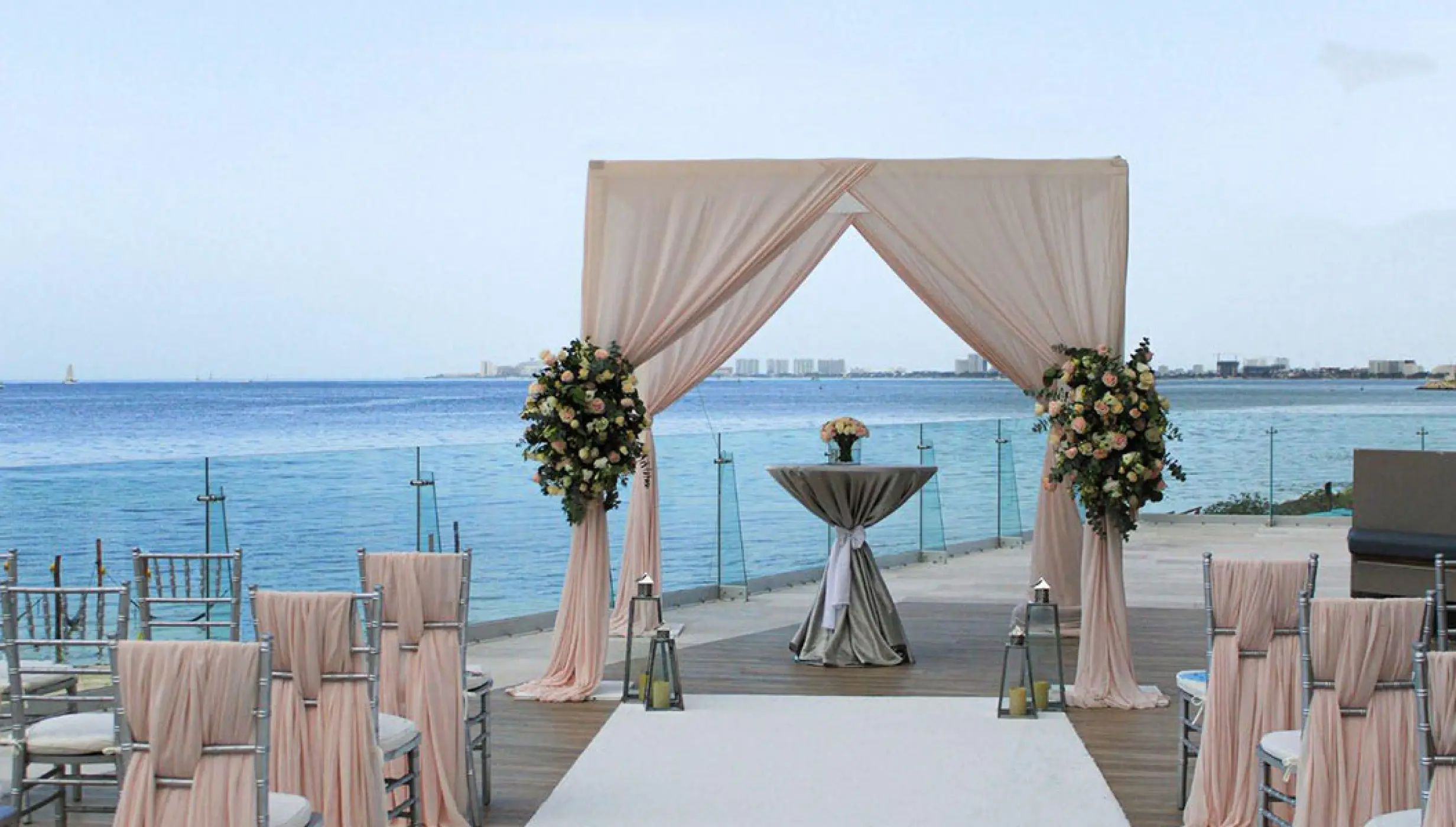 pool terrace with seating for weddings at Dreams Vista Cancun Golf and Spa