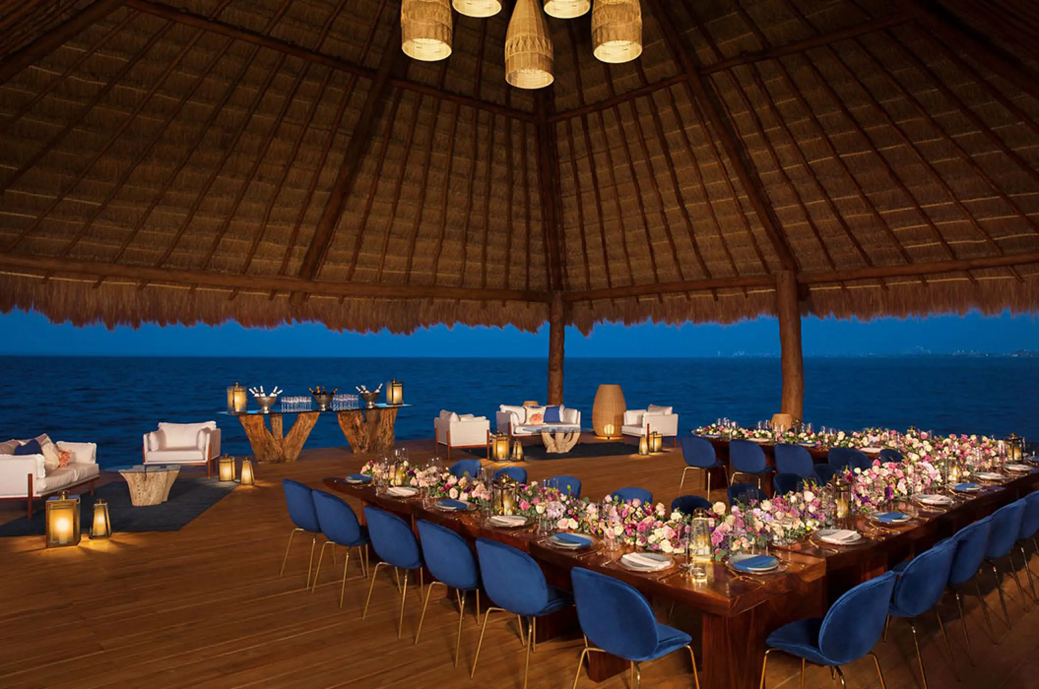 Wedding reception setup under a palapa at Dreams Vista Cancun