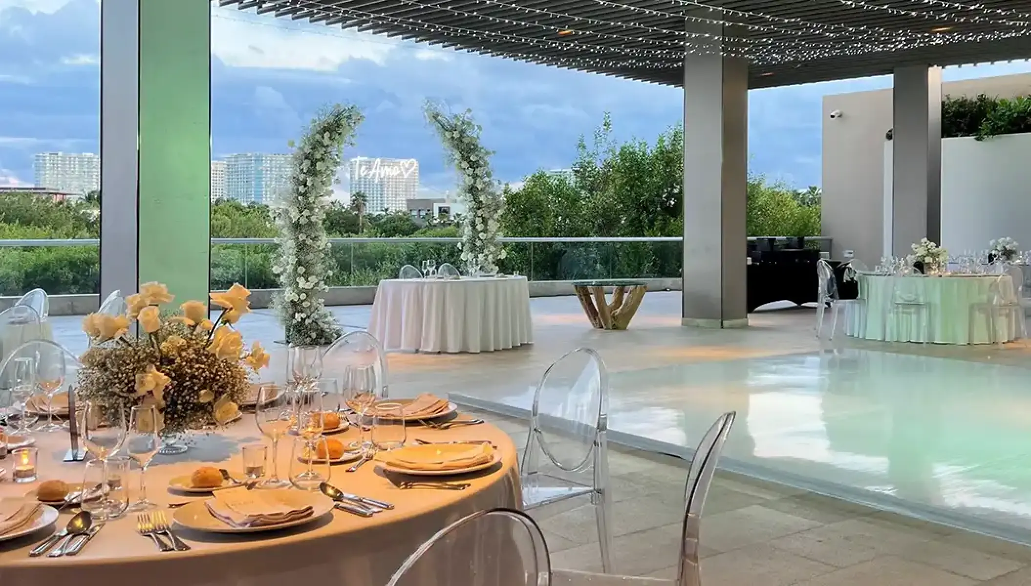 Grand Vista Terrace wedding reception at Dreams Vista Cancun with floral arches and white dance floor