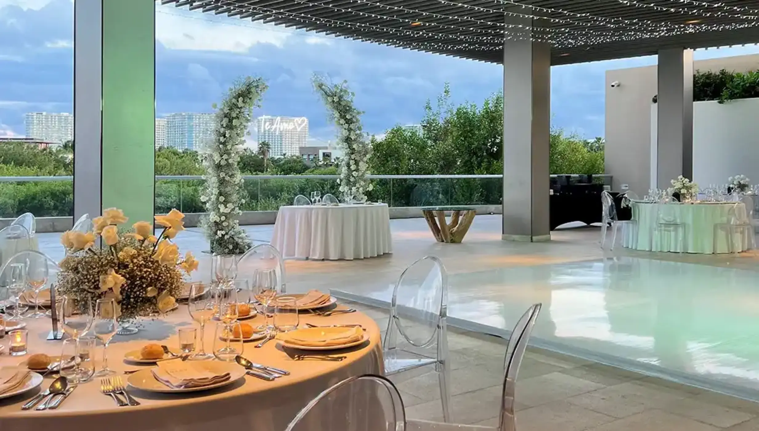 pool terrace with seating for weddings at Dreams Vista Cancun Golf and Spa