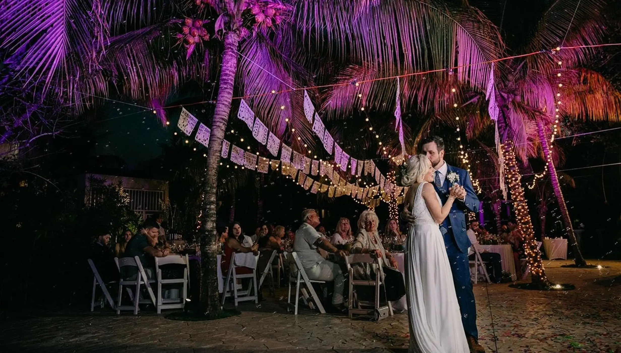 The bride and groom's first dance during an outdoor wedding reception at El Dorado Royale, Riviera Maya