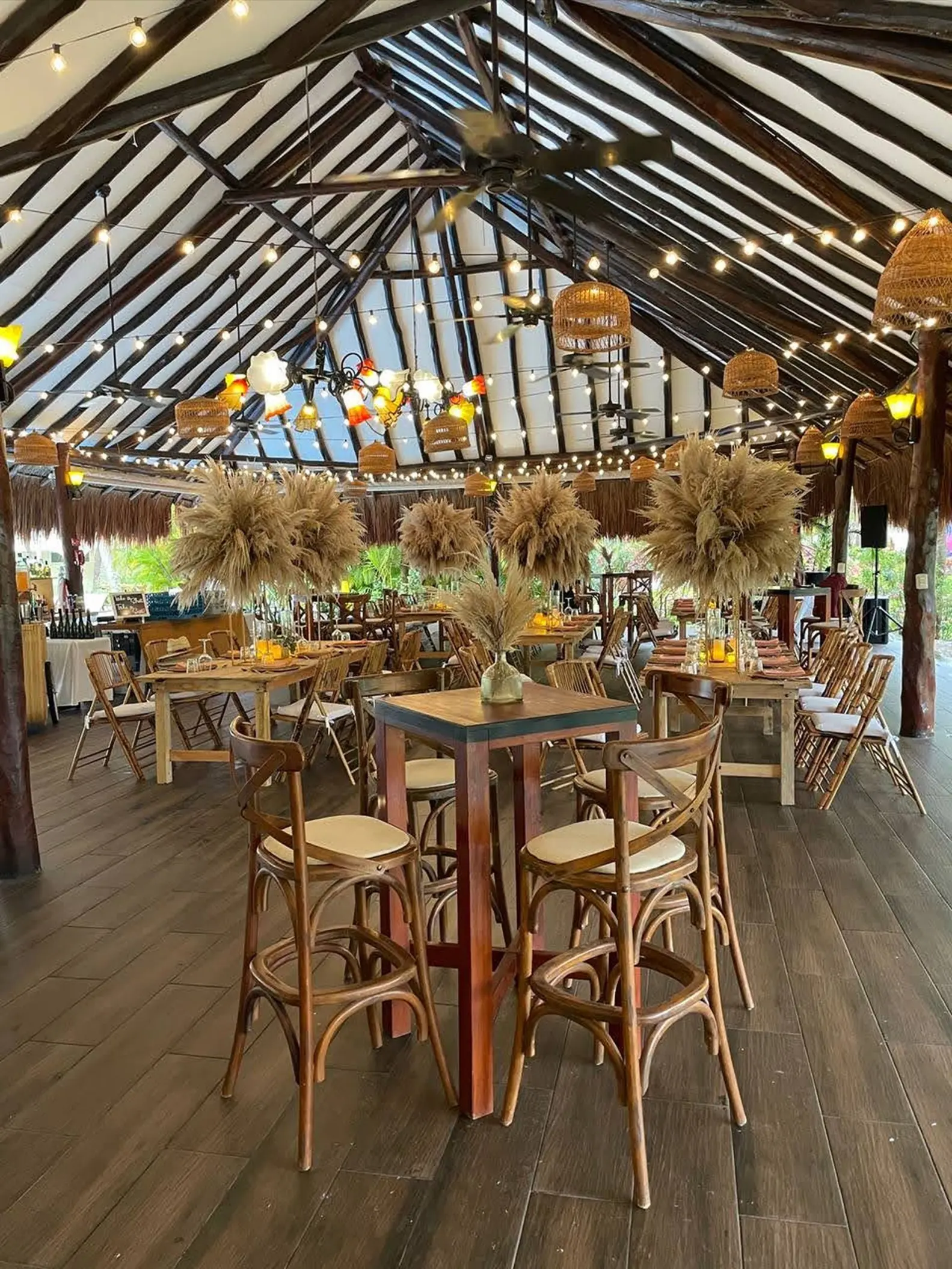 Tucanes bar wedding reception with pampas grass centerpieces at El Dorado Royale, Riviera Maya