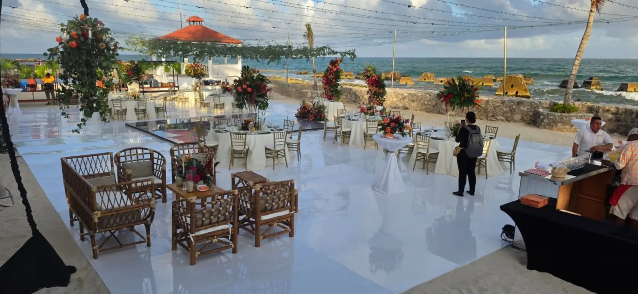 Outdoor wedding reception setup on a white platform at El Dorado Royale, Riviera Maya