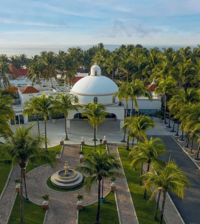 Aerial view of the white dome gazebo and palm gardens at El Dorado Seaside Palms, Riviera Maya