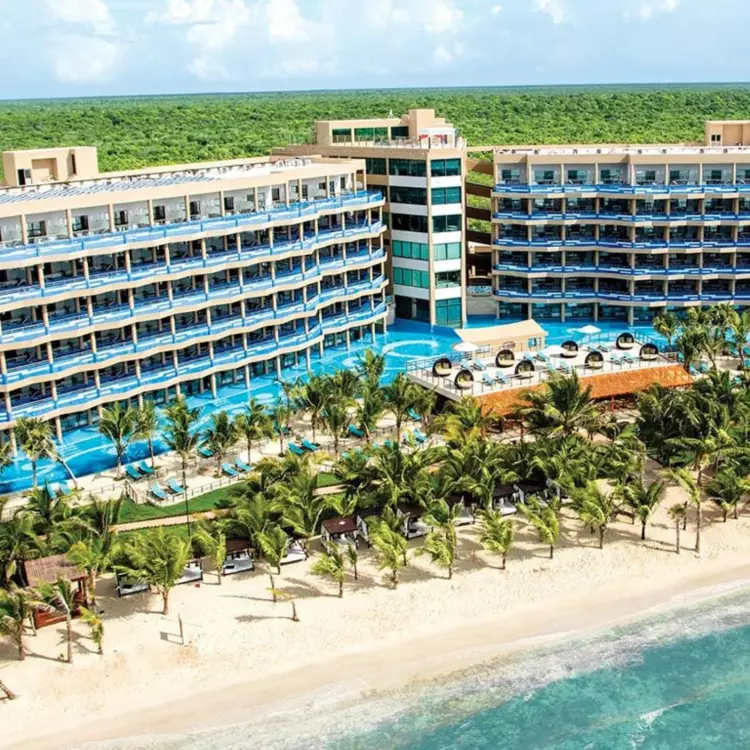 Aerial view of swim-up suites and beachfront at El Dorado Seaside Palms, Riviera Maya