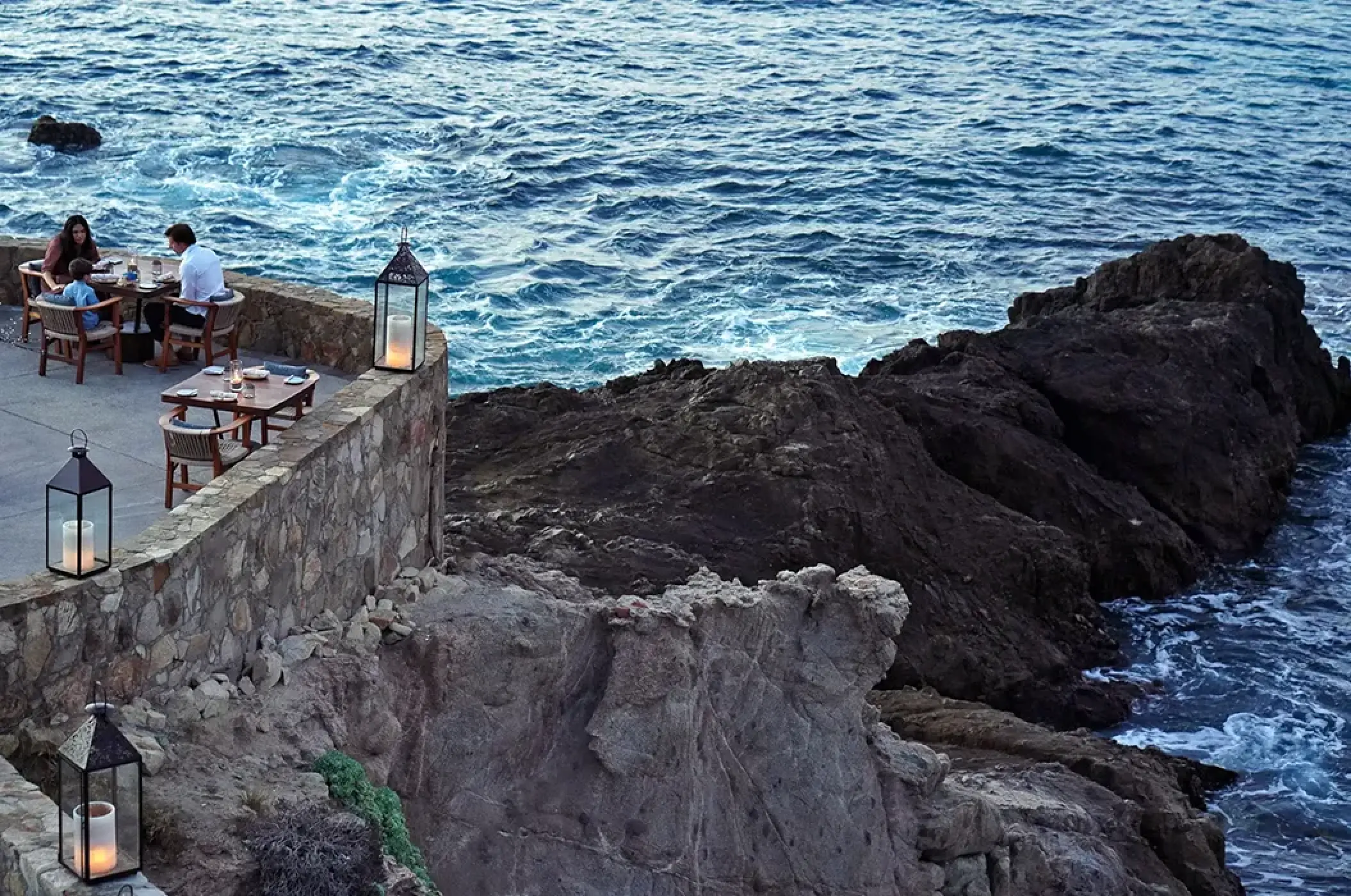 Cliffside dinner at Esperanza Cabo San Lucas overlooking the rocky coastline and ocean waves