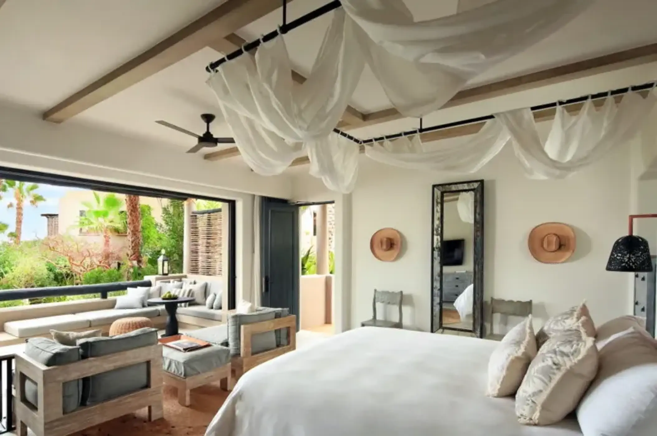 Garden view casita with draped ceiling and private terrace at Esperanza, Cabo San Lucas
