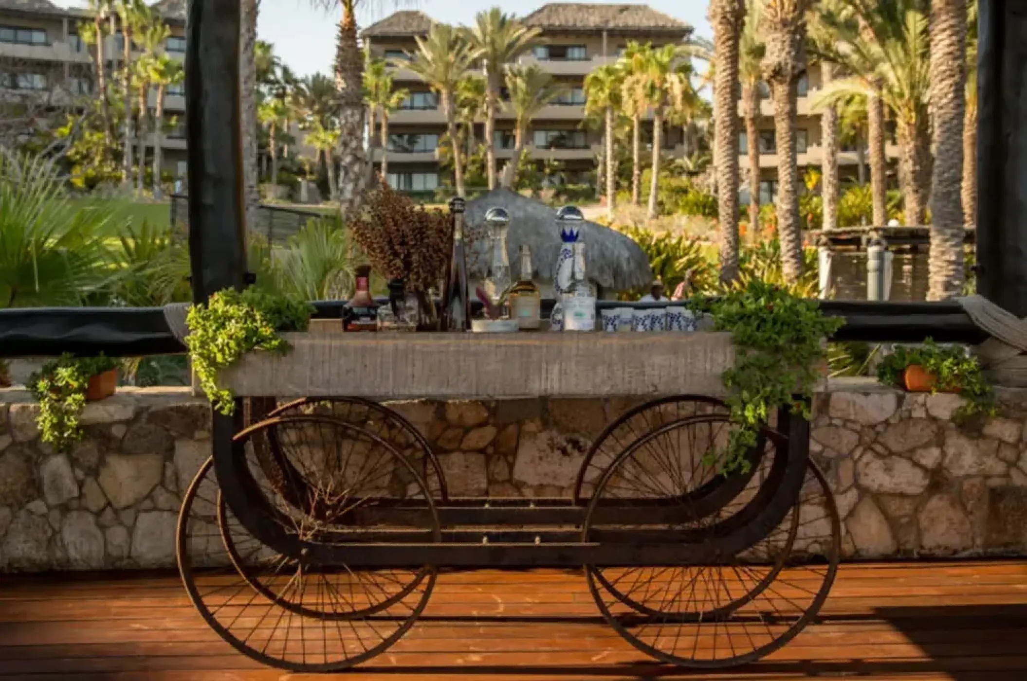 Rustic wooden tequila cart with bottle service at Esperanza, Cabo San Lucas
