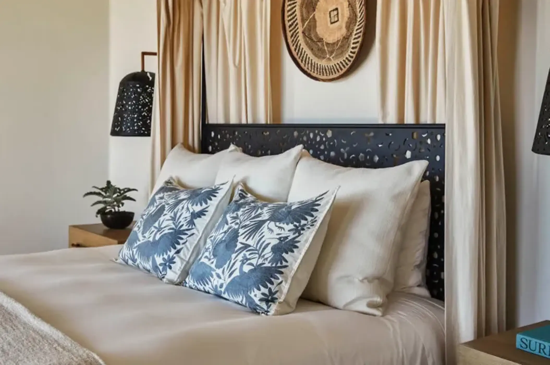 Luxury suite bedroom with embroidered pillows and canopy at Esperanza, Cabo San Lucas