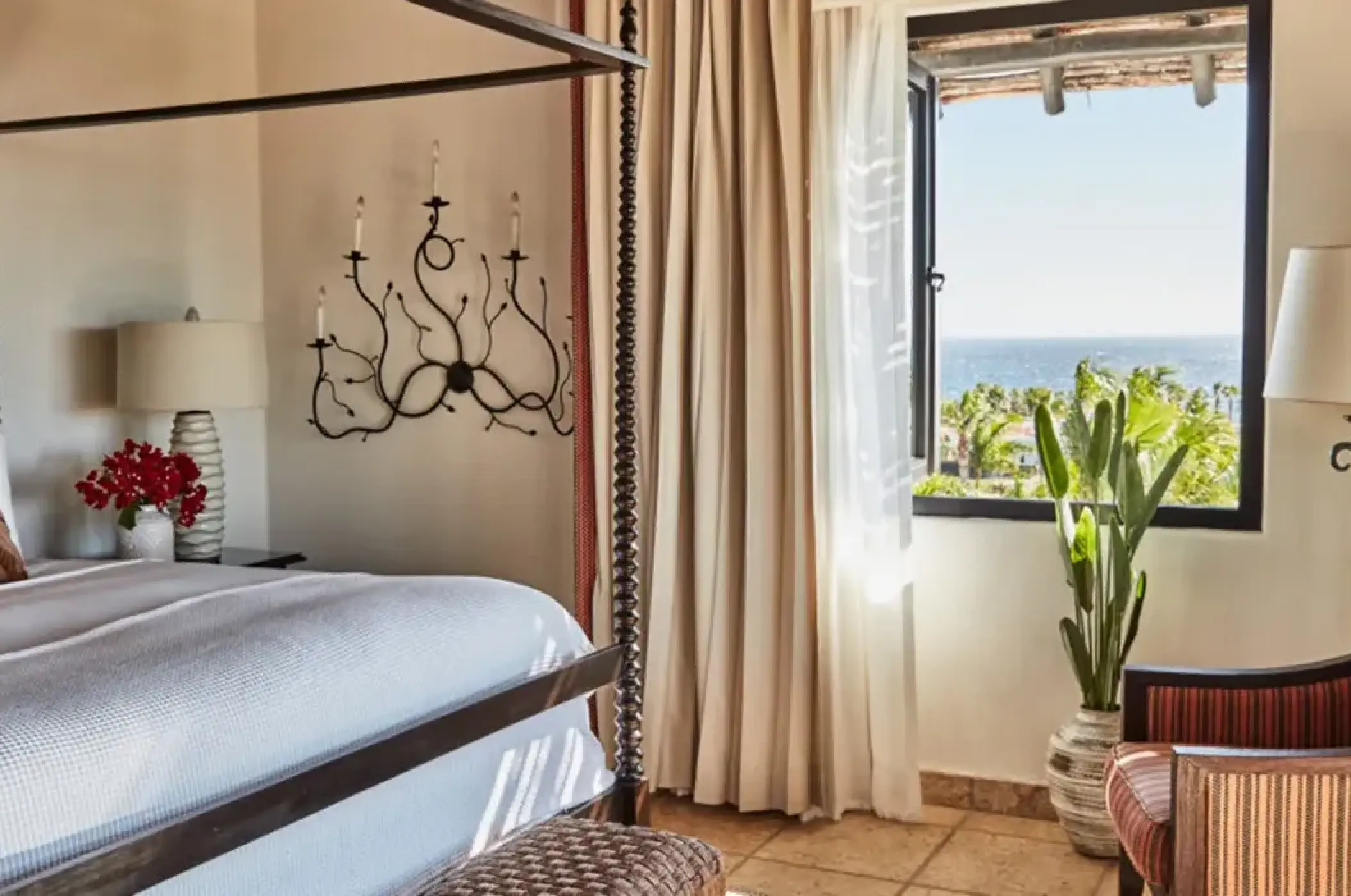 Ocean view suite with a canopy bed at Esperanza, Cabo San Lucas