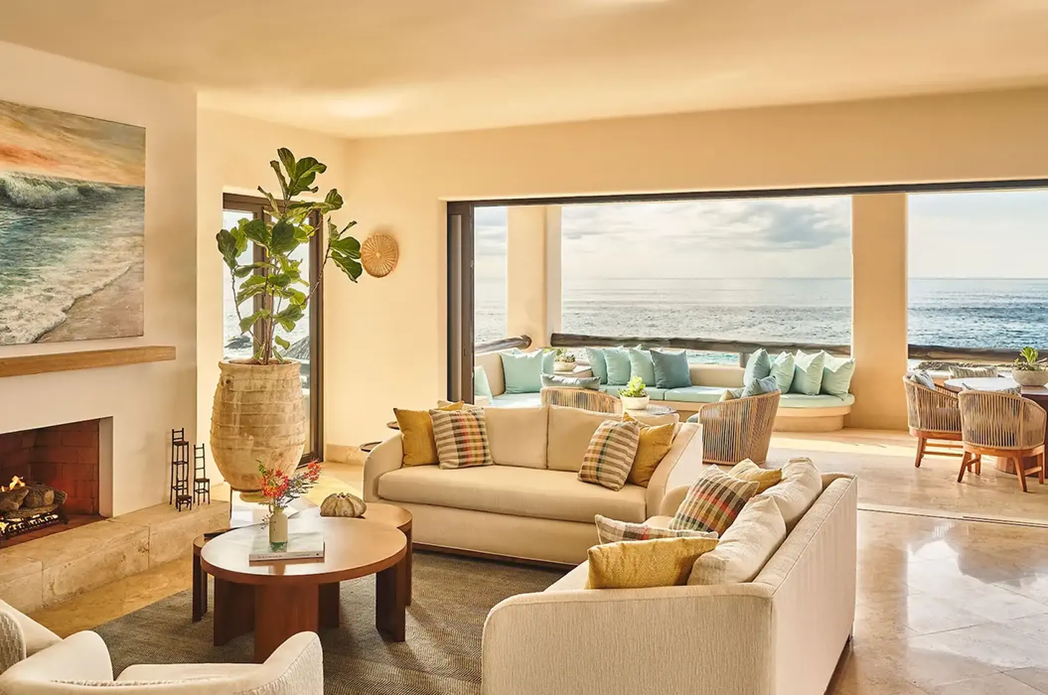Open-air villa living room with fire pit and ocean views at Esperanza, Cabo San Lucas