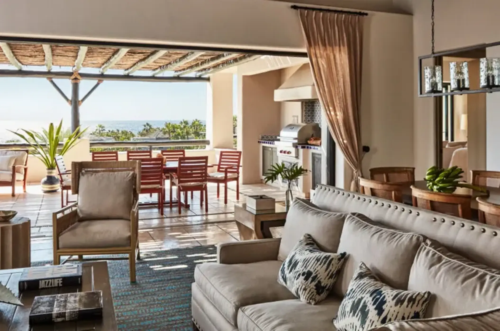 Villa lounge suite with terrace and outdoor kitchen at Esperanza Cabo San Lucas