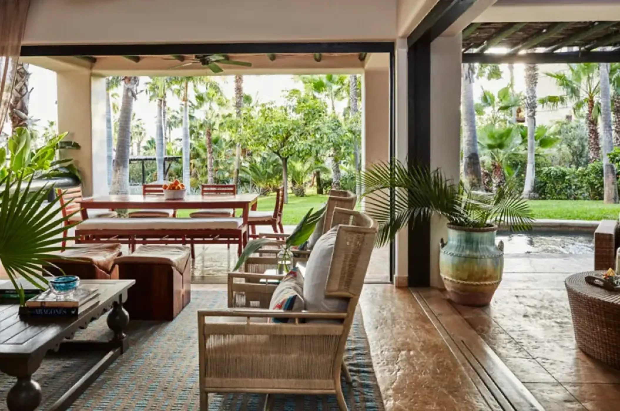 Esperanza Cabo San Lucas villa suite with indoor-outdoor living area and terrace overlooking gardens