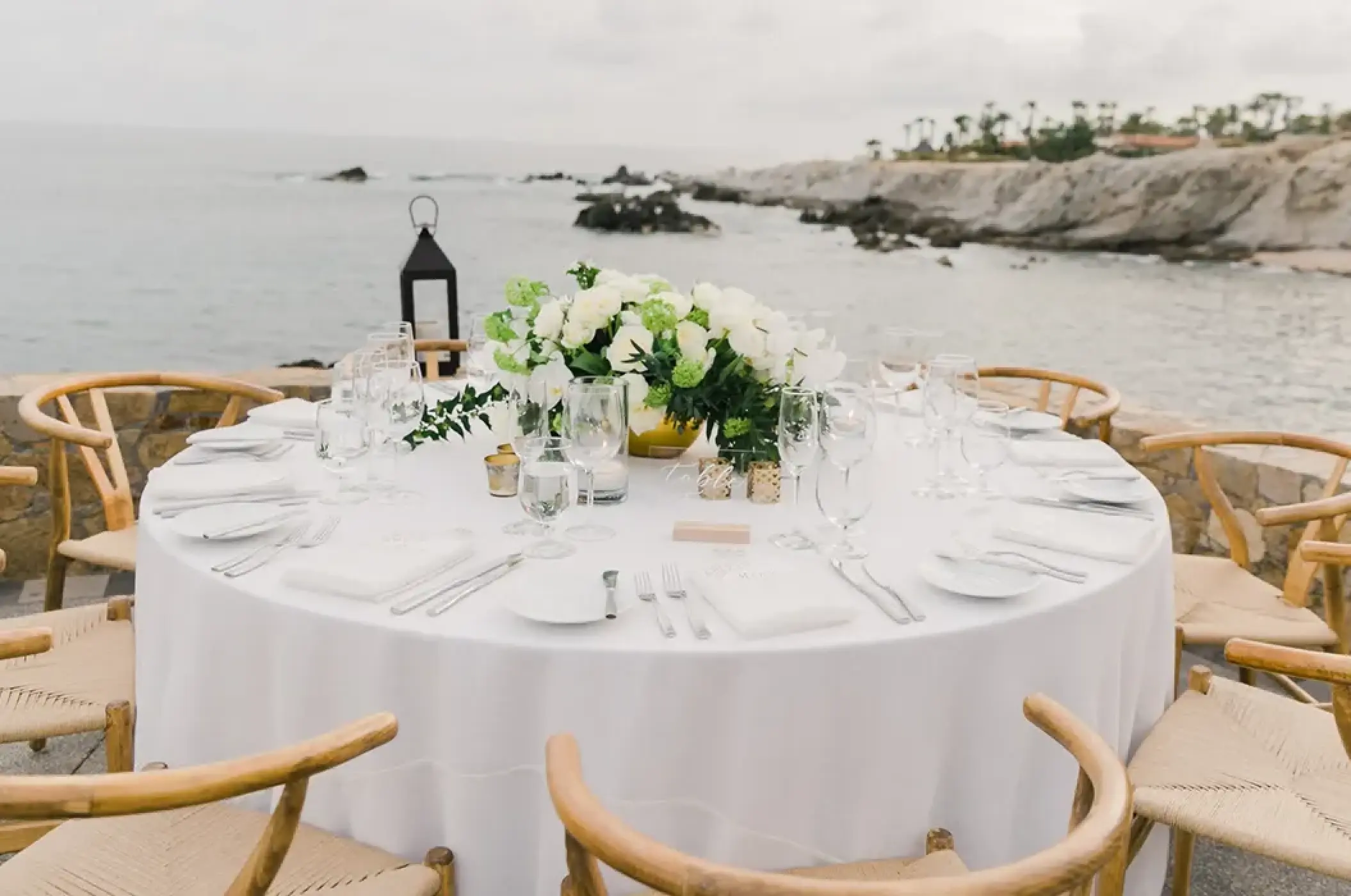 Cliffsided wedding reception table at Esperanza Cabo San Lucas
