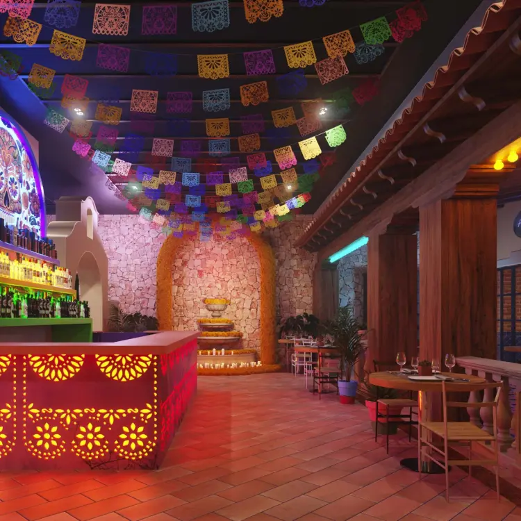 Agave bar with colorful papel picado banners at Excellence Coral Playa Mujeres, Cancun
