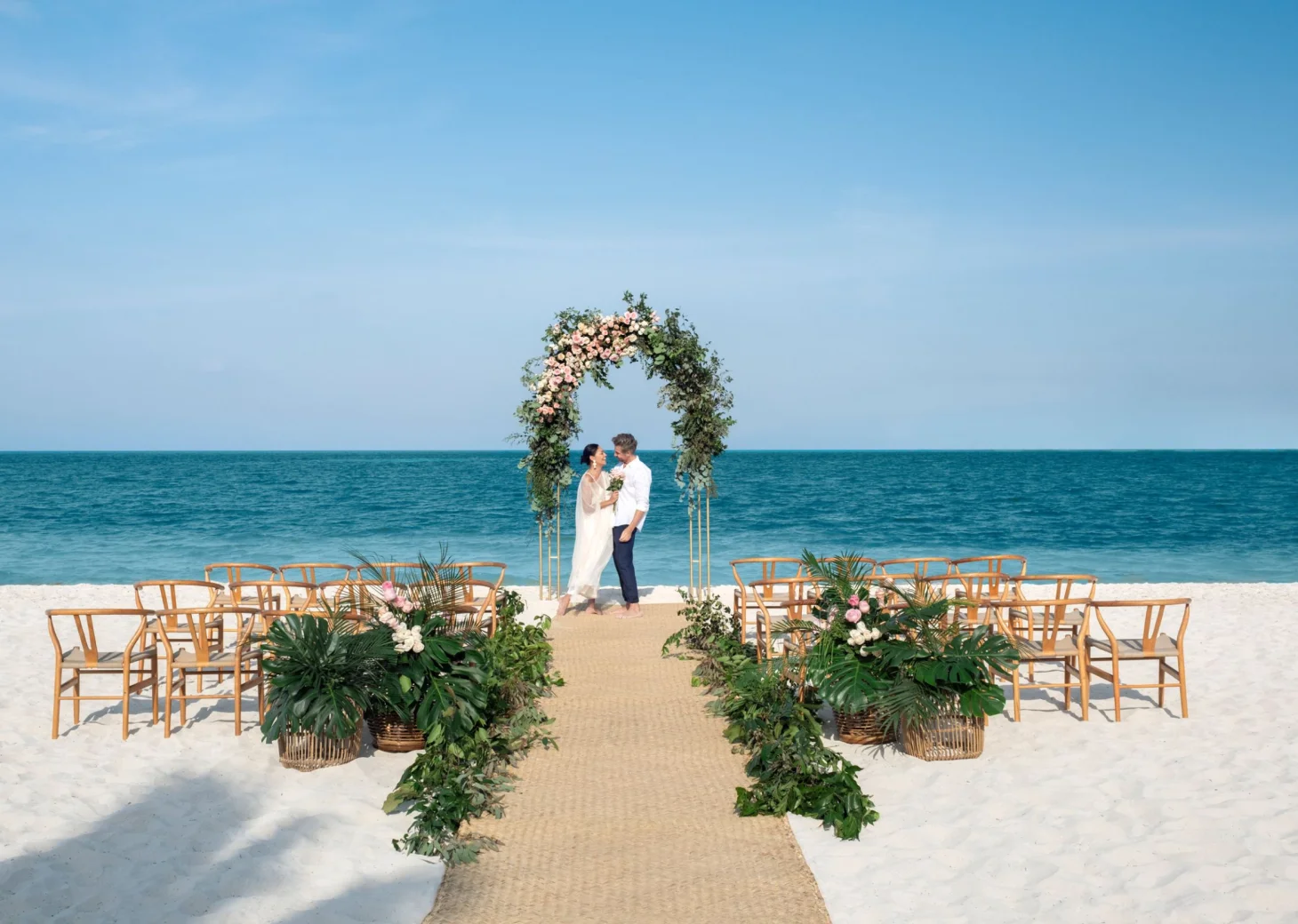 bride and groom on the beach at Excellence Coral Playa Mujeres