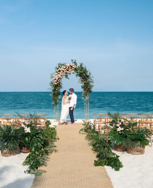 bride and groom on the beach at Excellence Coral Playa Mujeres