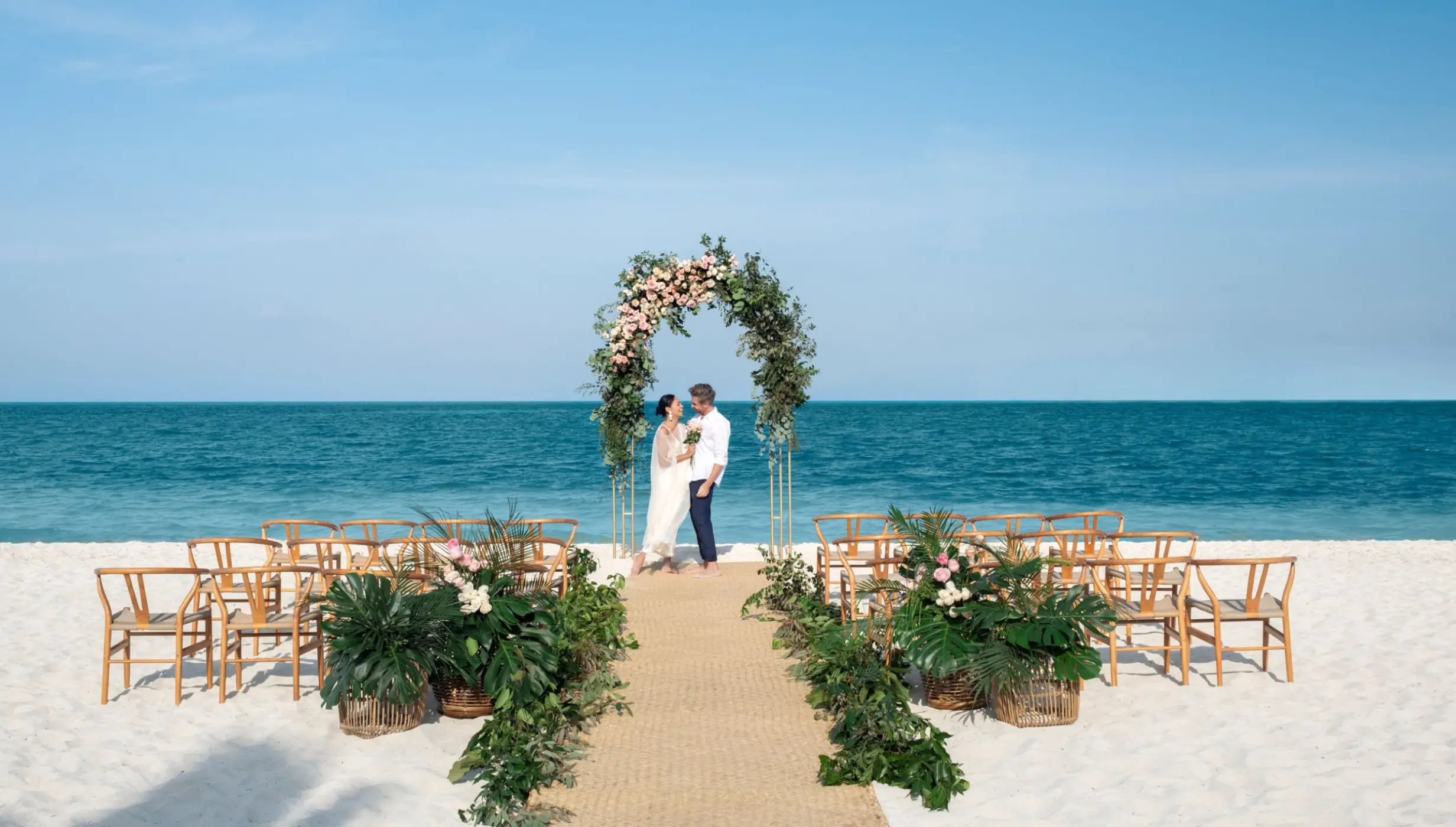bride and groom on the beach at Excellence Coral Playa Mujeres